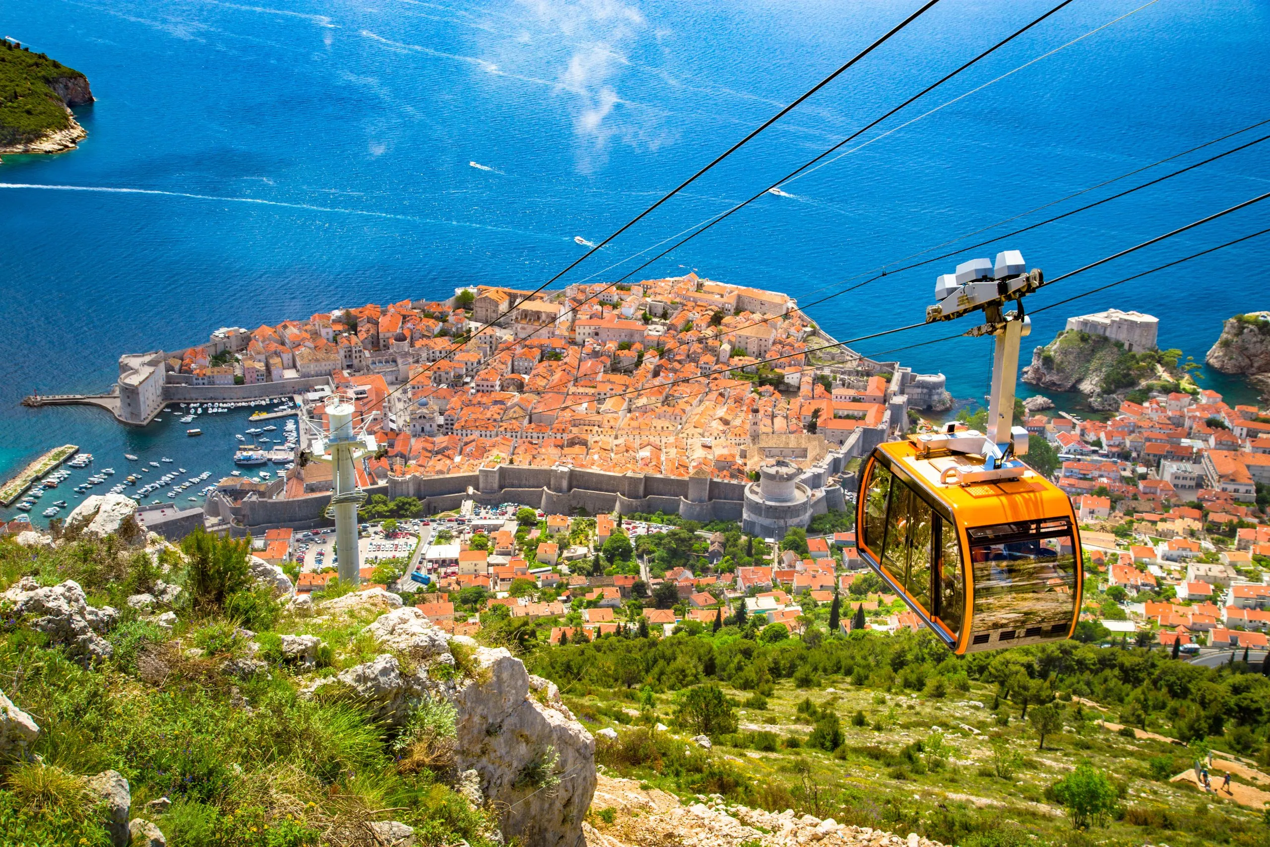 Old town of Dubrovnik with cable car ascending Srd mountain, Dalmatia, Croatia